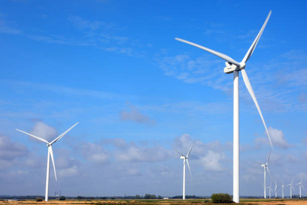 istock wind turbine with three blades rotating using wind power to produce electricity 2180310159