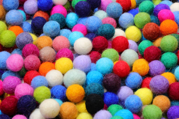 istock background ofwool balls ideal for creating necklaces by piercing them with a needle and other fashion accessories and for hobbying 2180311844