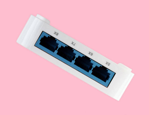istock White 8 Port Plastic Ethernet Switch isolated on pink background 2180318379