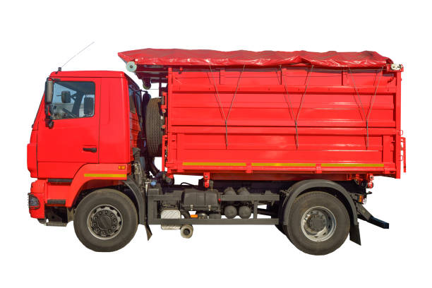 Dump track isolated. Red construction truck on empty background. Heavy construction equipment. High quality photo