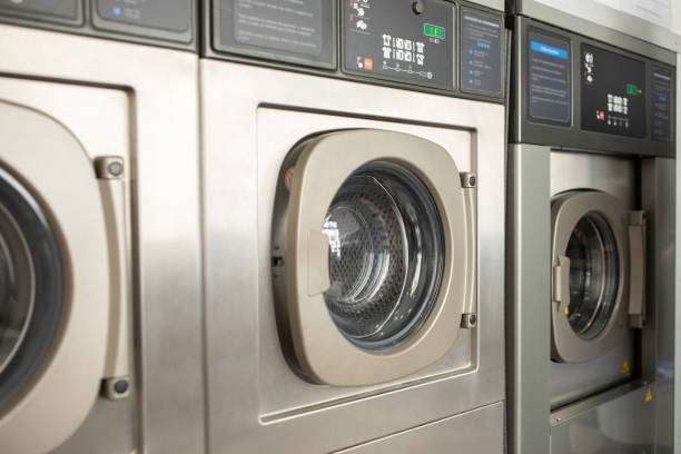 istock Washing machines in a modern laundromat during daylight hours 2180328262