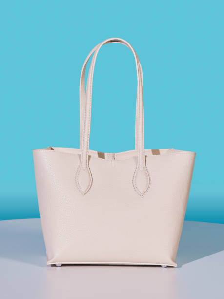 istock White leather women's bag on a white ground, turquoise background 2180333878