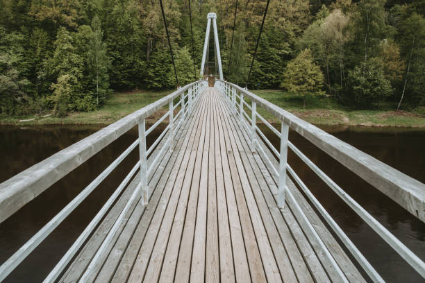 Pedestrian bridge over Gauja river in Sigulda, Latvia at spring