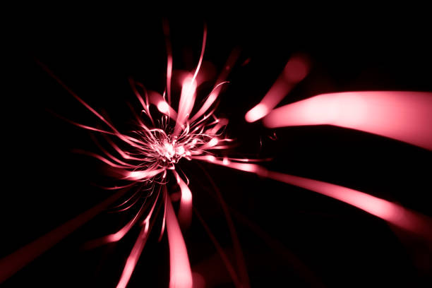 red sparks from the grinder glowing in the dark straight ahead