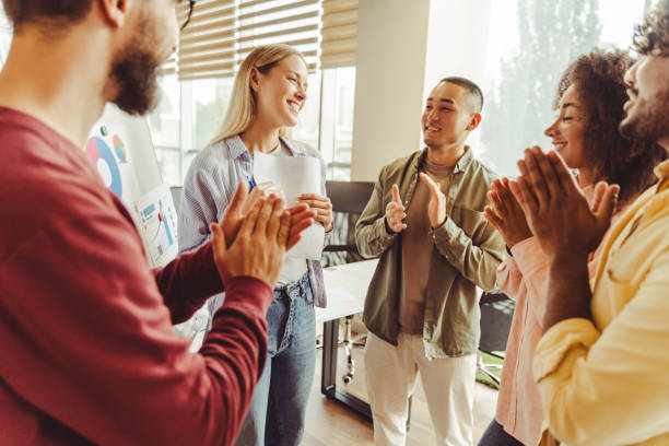 istock Diverse team clapping to their colleague after successful presentation 2180338182