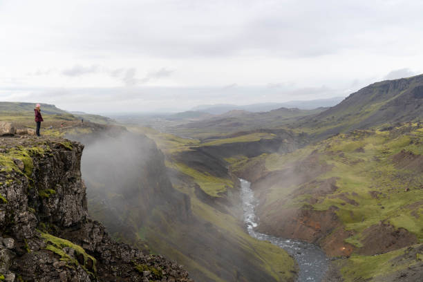 istock A man over a gorge with a waterfall in the background 2180339729
