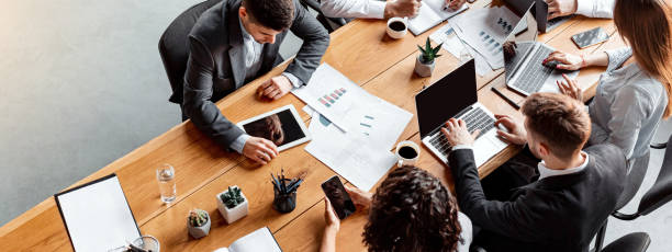 istock Multiracial Business Team Working Sitting At Table In Office, High-Angle 2180340724