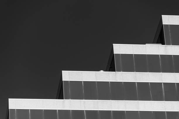 Geometric modern architecture against a plain background in black and white
