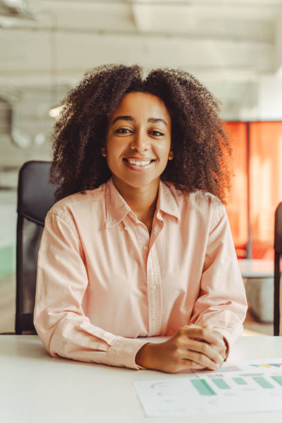 istock Young manager woman smiling while working in the office 2180342509