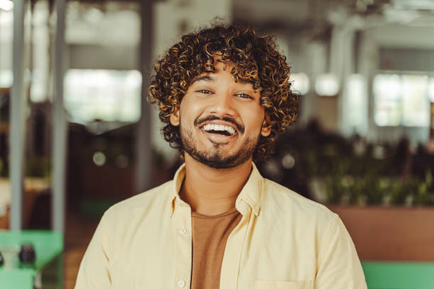 istock Young indian freelancer smiling at the office 2180342554