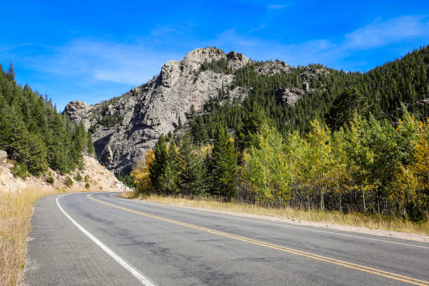 istock Curving Road Alongside Rocky Outcrops 2180344056