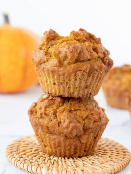 istock Pumpkin spice muffins on white background, close-up 2180348549
