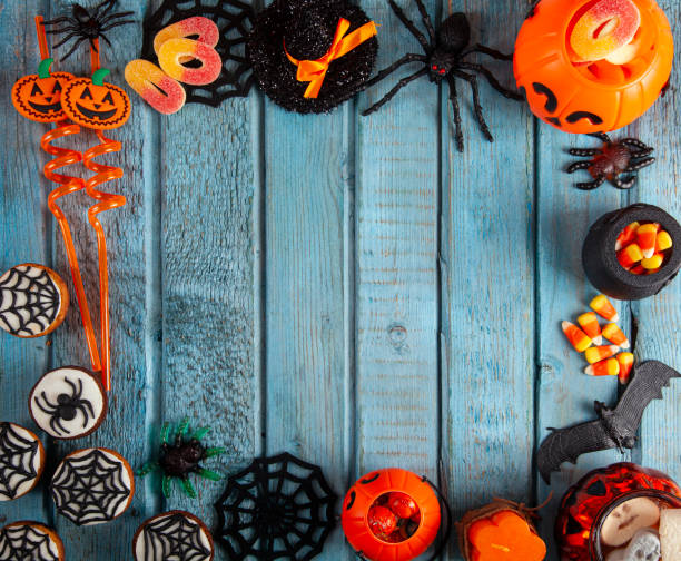 istock Halloween party decorations frame on blue wooden rustic table 2180350684