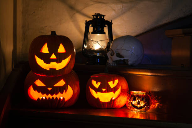 istock Halloween pumpkins on front step with Halloween decorations 2180350703