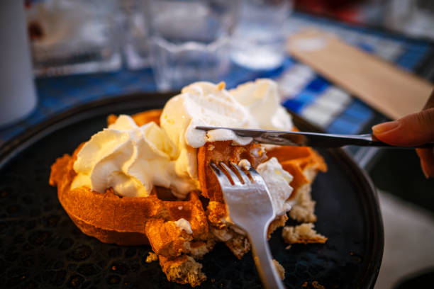 Waffle topped with a generous dollop of fluffy, sweet whipped cream. Pure indulgence.
