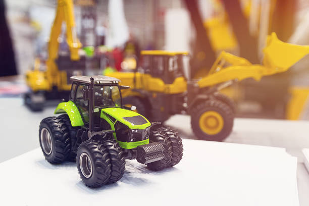 Model modern tractors standing on display at exhibition. Industry