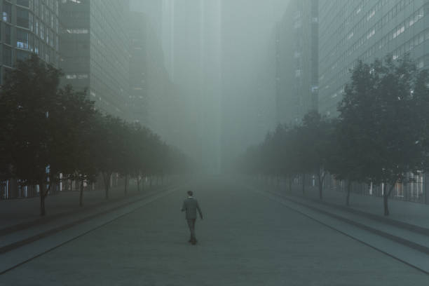 istock Businessman walking in empty city street 2180353549
