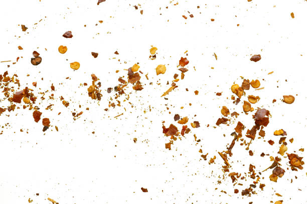 istock dried red chili pepper flakes and seeds isolated on white background 2180358842
