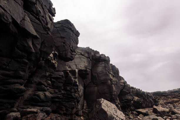 istock scenery view of volcano stones under cloudy sky 2180359585