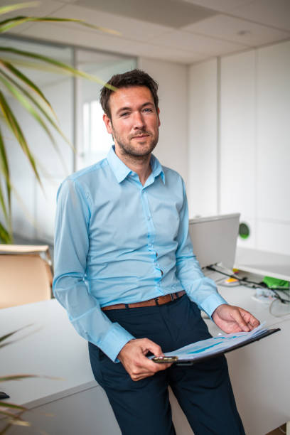 istock Caucasian Business Executive Engaged in Office Setting 2180361012