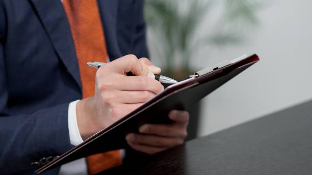 istock Hands of an Asian businessman having an interview 2180363215