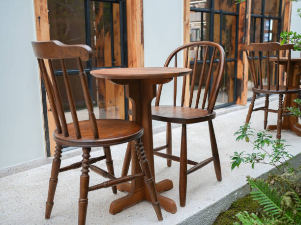 istock Wooden table and chairs in seating area 2180369357