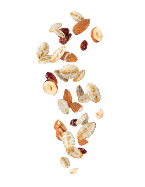istock Granola with flakes, nuts and raisins isolated on a white background 2180375337