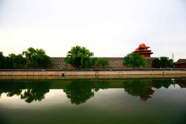 Beijing, China. 5 November 2024. People walking around the moat of the Forbidden City