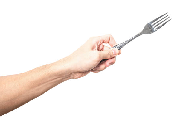 istock Male hand holding a black steel fork isolated on white background. 2180383426