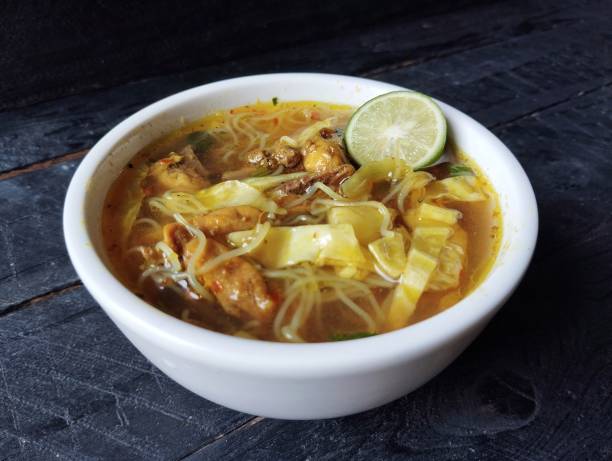 istock Soto ayam or chicken soup with vegetables, Indonesian food famous in Java 2180390930