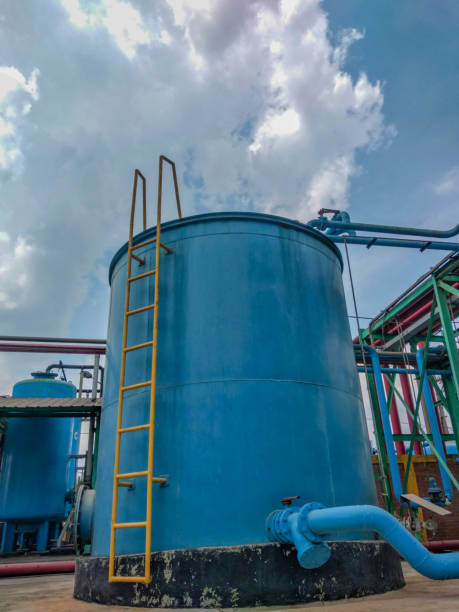 istock blue industrial water tank with yellow ladder 2180394489