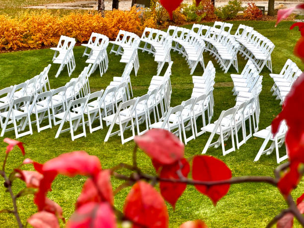 istock white chairs in a semicircle shape on the grass preparing for a wedding 2180395051
