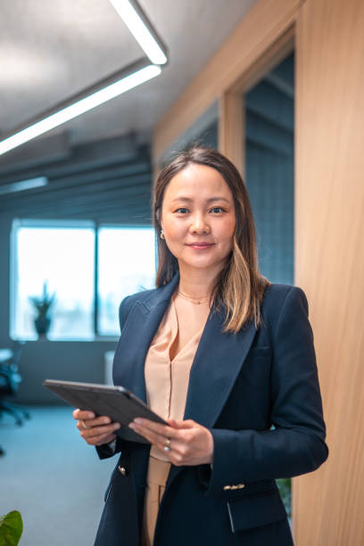 istock Confident Asian Businesswoman in Modern Office 2180398069