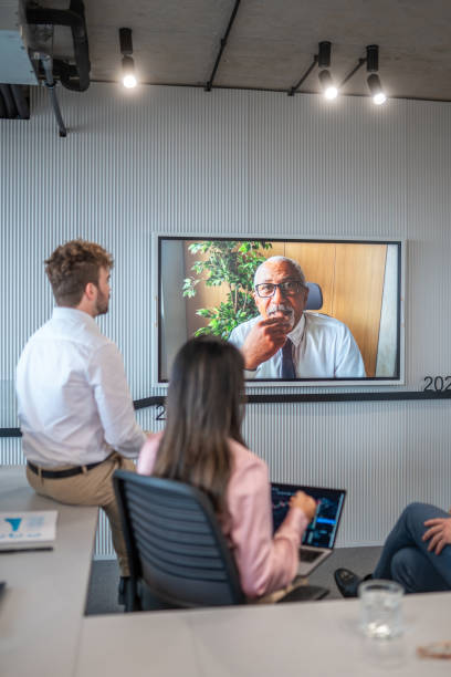 istock Diverse Team Consults Senior Manager via Video Conference 2180398083