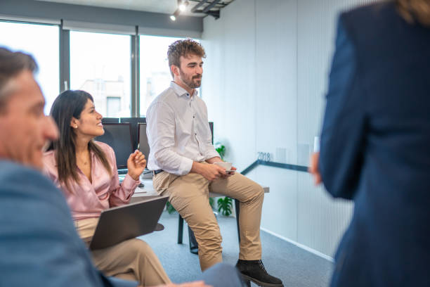 istock Diverse Team in Strategy Session with Laptop in Modern Office 2180398090