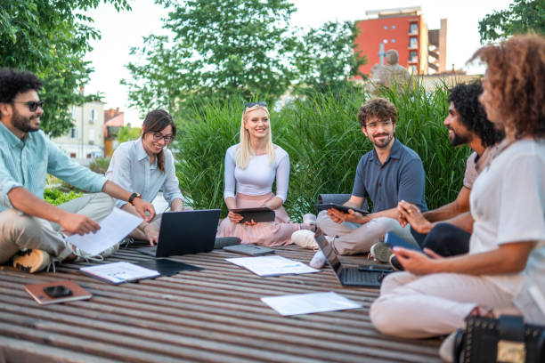 istock Multicultural Executives in Outdoor Business Strategy Session 2180398512