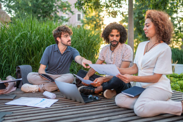 Diverse Executives in Outdoor Business Strategy Session