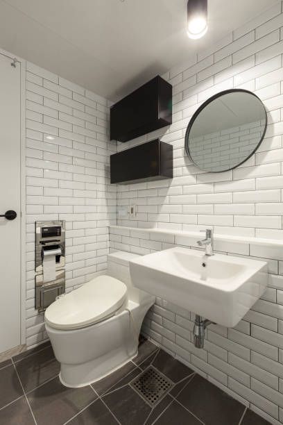 istock white flush toilet in modern bathroom interior 2180405271