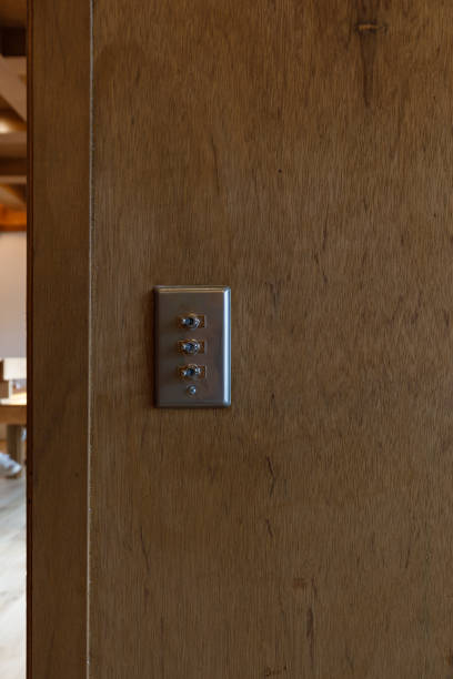 istock Vintage put light switch on wooden interior wall 2180405371