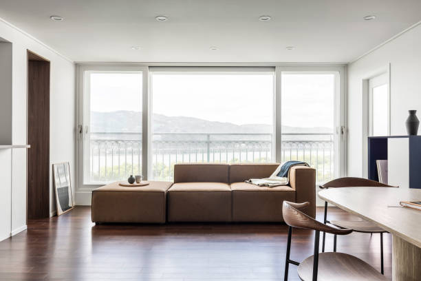 istock Minimalist interior design of modern living room with sofa 2180405545