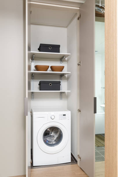 istock home laundry room with modern washing machine, shelving unit 2180405651