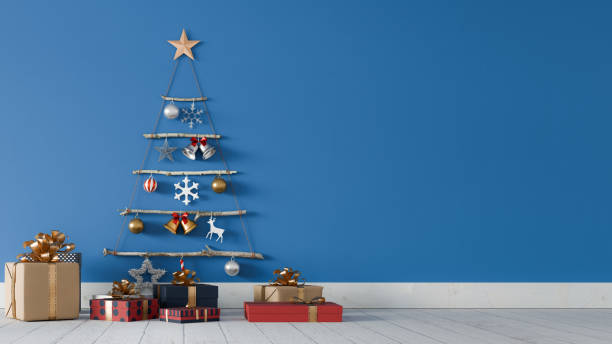 istock A tree-shaped Christmas decoration hangs on a blue wall, with several gift boxes in front. 3d rendering 2180408117