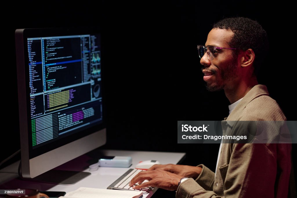 Focused Programmer Analyzing Code On Computer Screen Stock Photo ...