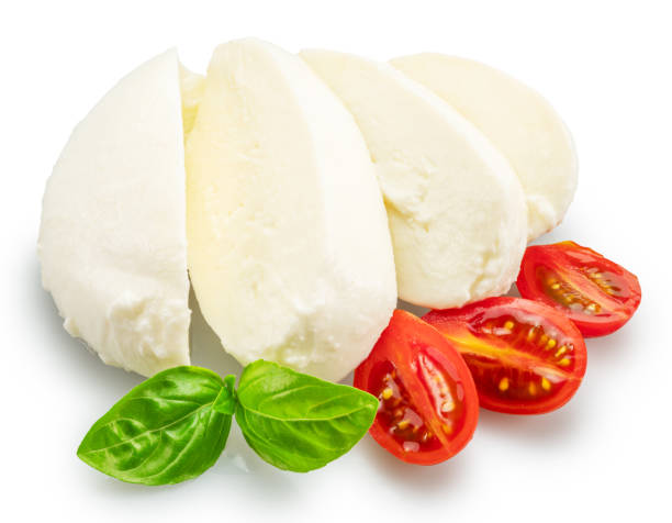 istock Sliced mozzarella cheese with basil leaves and cherry tomatoes on white background. File contains clipping path. 2180418336