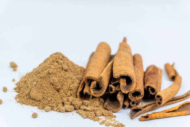 istock top view Cinnamon sticks and cinnamon powder a side isolated on white background. herb and spices concept. 2180420093