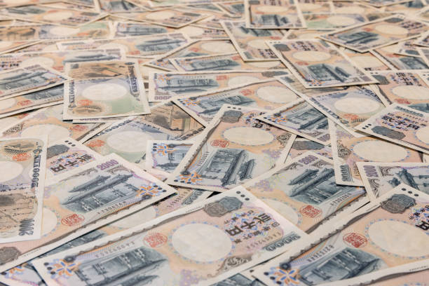 istock Japanese yen banknotes arranged in seamless pattern highlight intricate currency design and financial significance 2180421952