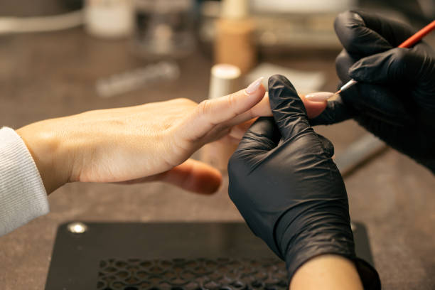 istock View of the process of a manicure being performed by a master 2180428999