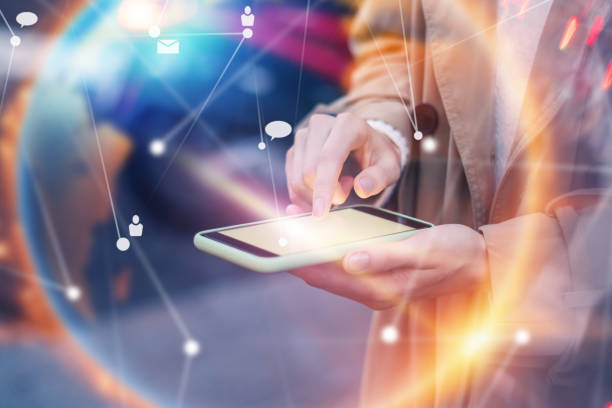 istock Young woman with smartphone in her hands. Outdoors. Global networking concept 2180433498