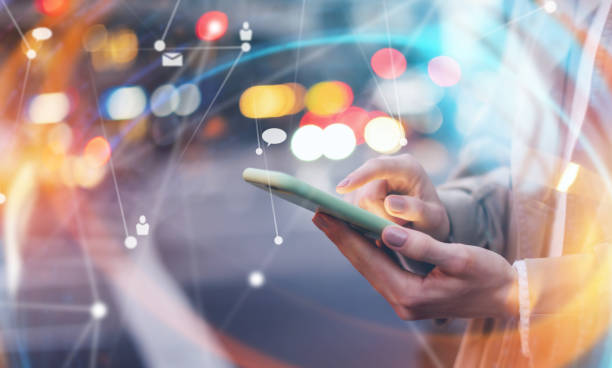 istock Young woman with smartphone in her hands. Outdoors. Global networking concept 2180433503