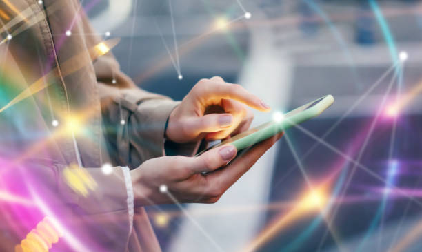 istock Young woman with smartphone in her hands. Outdoors. Global networking concept 2180433521